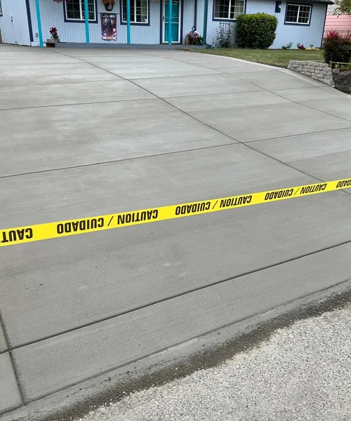 Broom finish driveway and decorate borders in Federal Way 